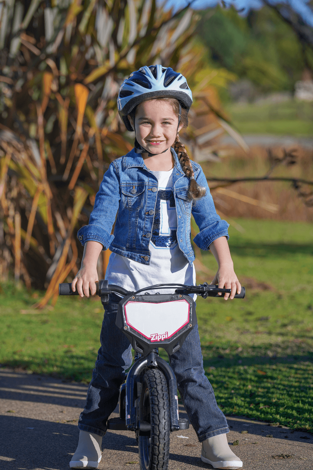 image of a young girl riding an electric balance bike