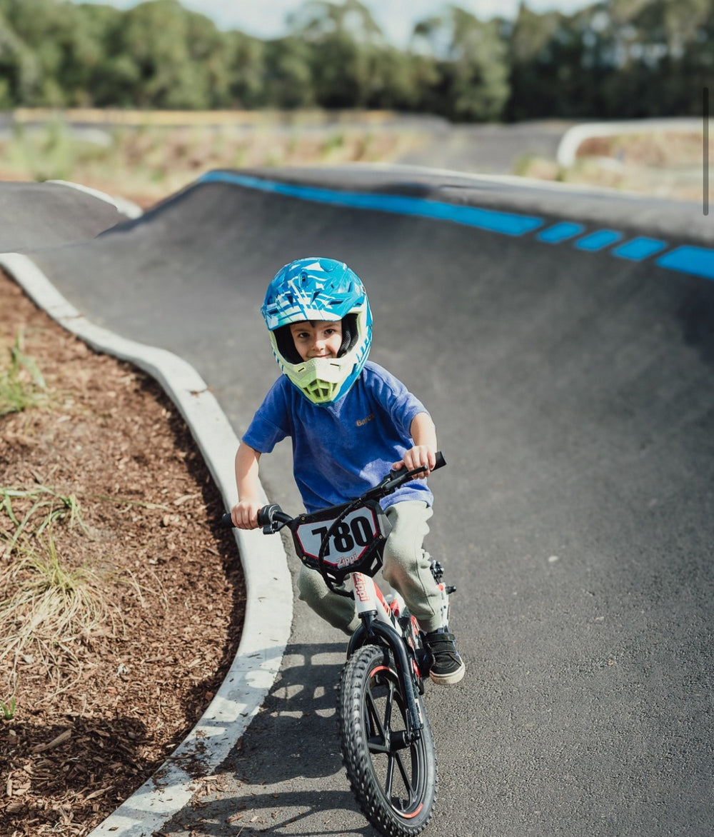 Boy on Rippa 16" balance bike at pump track
