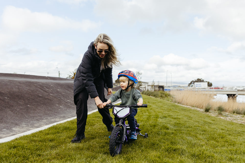 mother with son on rippa 12" zippi balance bike