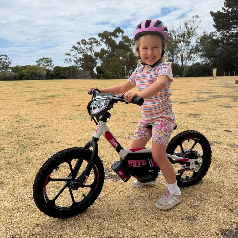 girl on ebike in backyard