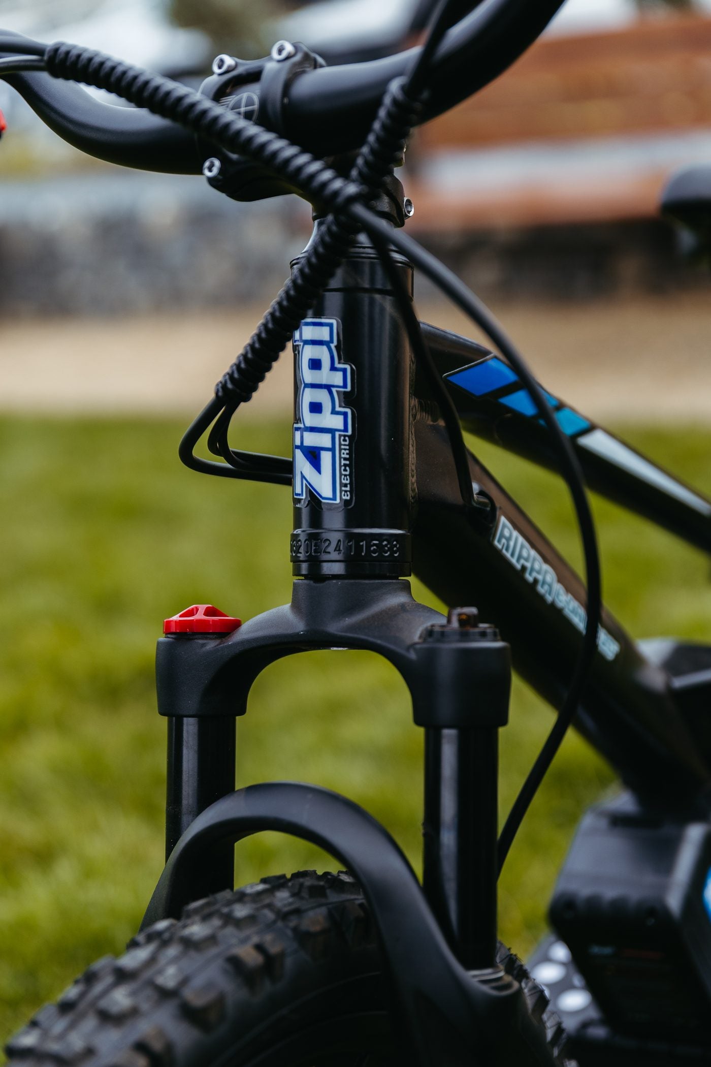 Close-up of the Rippa 20 inch front fork and Zippi badge.