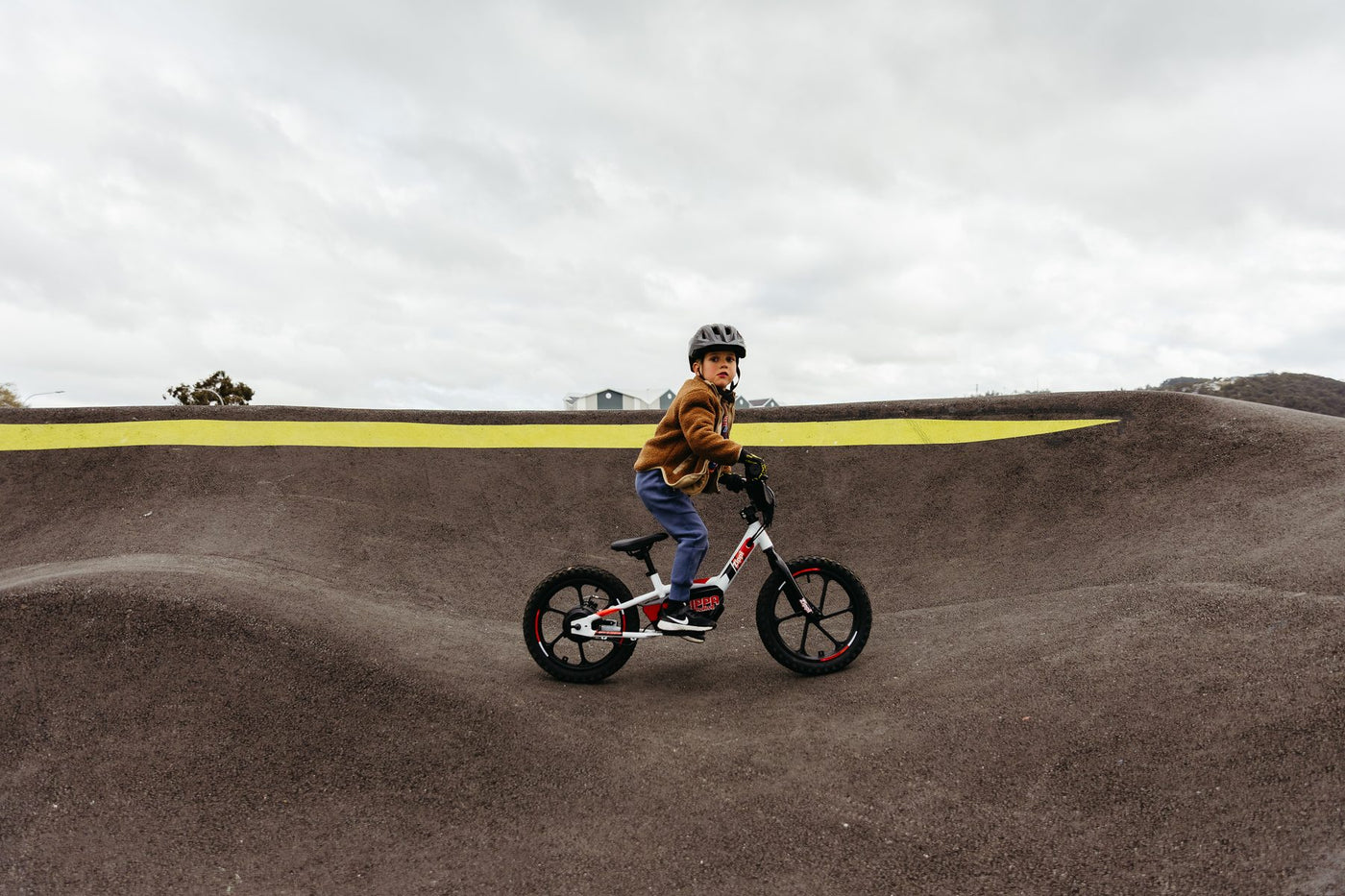 Young rider on the original Zippi Ride 10 inch at a Tasmanian pump track.